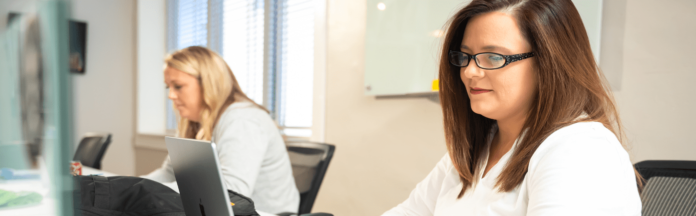 Employees focusing on work banner