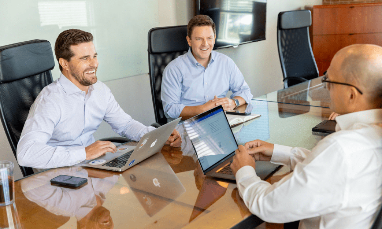 Employees in meeting hero banner