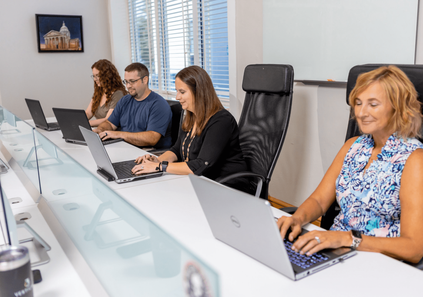 Employees in meeting hero banner